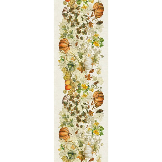 A detailed repeating textile pattern on a cream cotton-linen table runner, featuring illustrated harvest pumpkins, clusters of green grapes, and vibrant autumn foliage in orange, gold, and green tones.