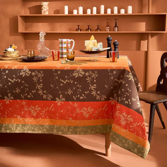 Striped autumn leaf cotton jacquard tablecloth styled on a festive dining table in a terracotta room.