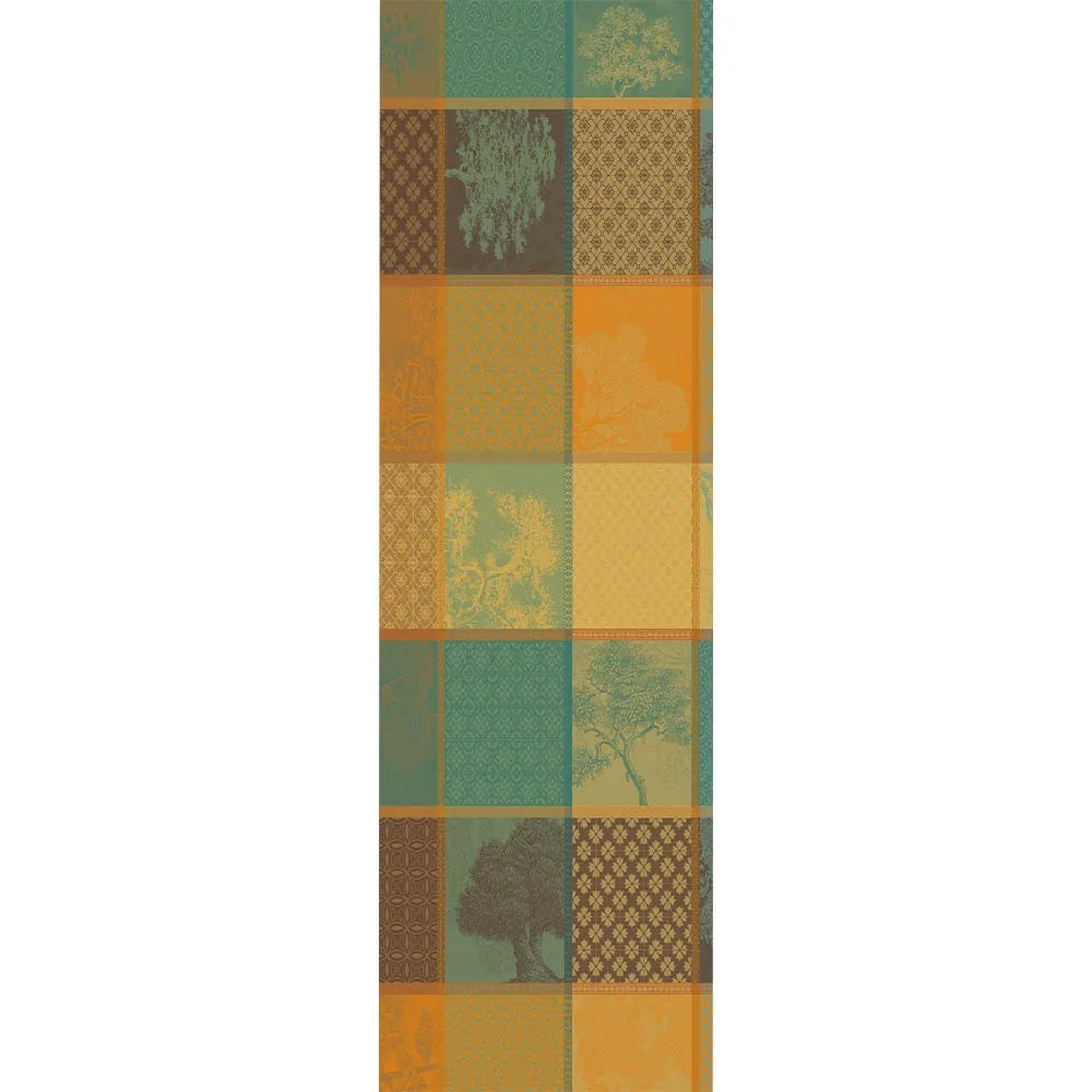Patchwork geometric plaid cotton jacquard table runner in teal, amber, gold, and brown.