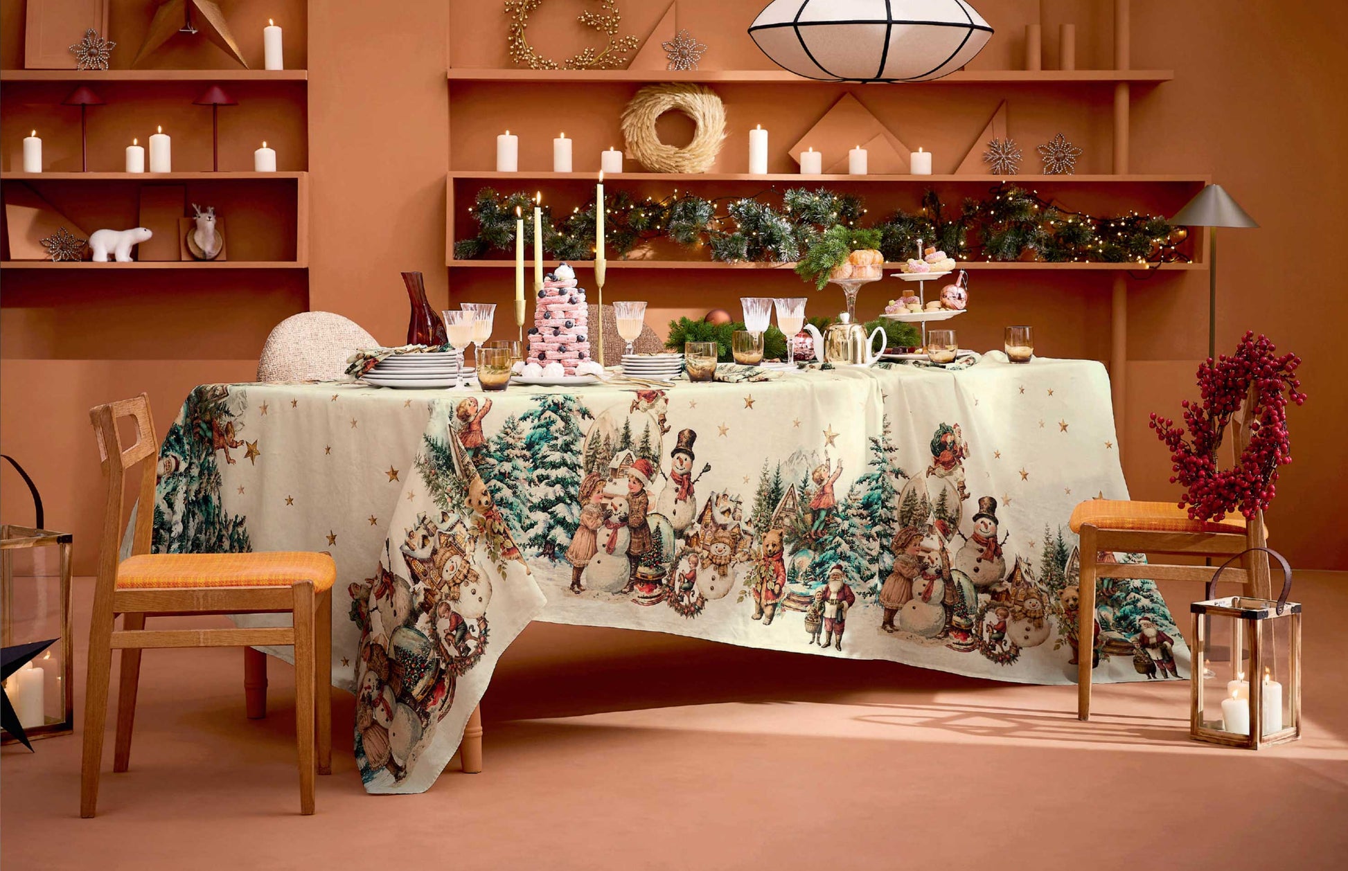 A festive winter-themed tablecloth featuring a detailed print of vintage snowmen, Santas, and evergreen trees on a cream cotton-linen blend fabric.