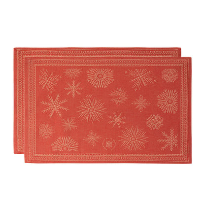 Red Sous Les Étoiles French jacquard placemats with gold snowflakes.