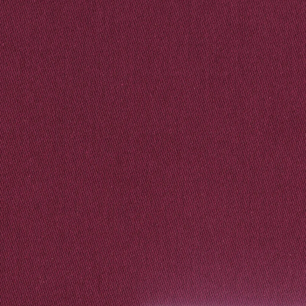 A close-up of a confettis cotton napkin in a garance aubergine.