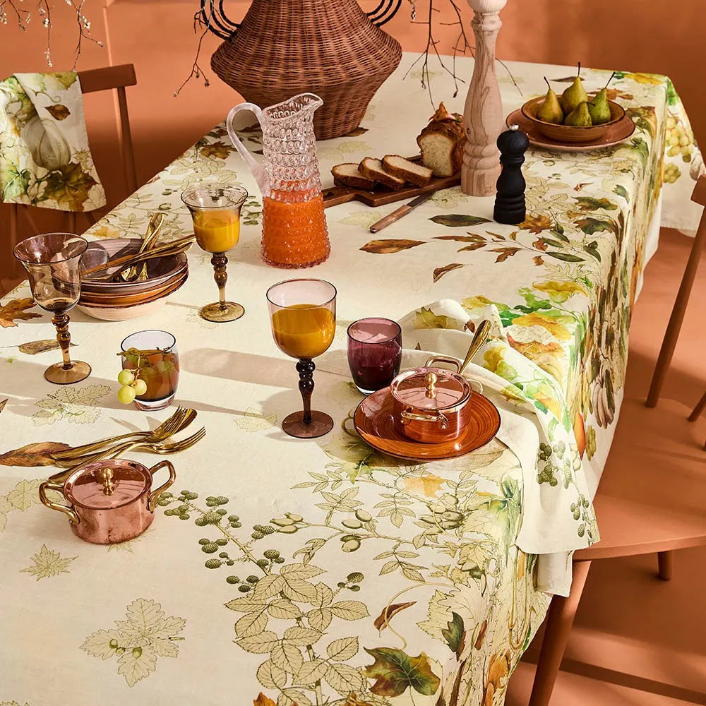 Harvest pumpkin and foliage printed cotton-linen tablecloth styled on an autumn dining table.