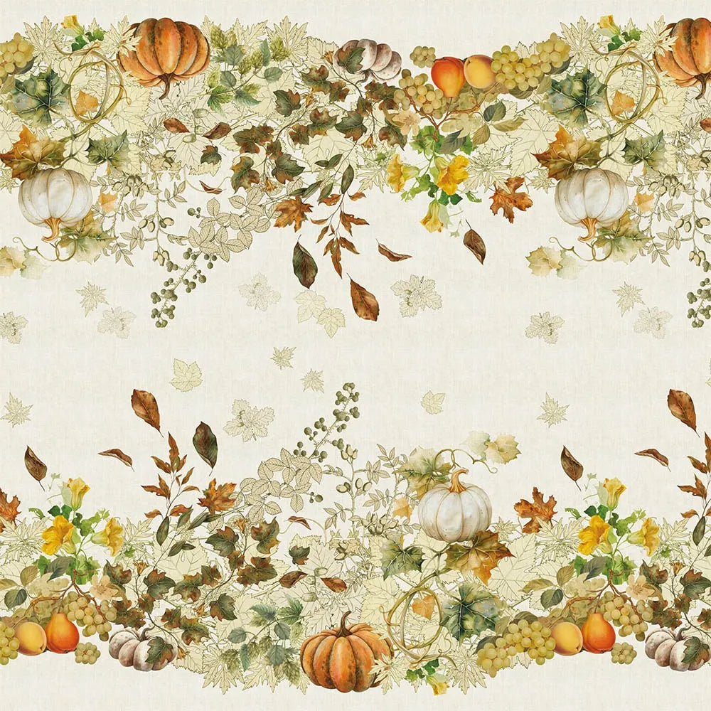 A detailed repeating textile pattern on a cream cotton-linen tablecloth, featuring illustrated harvest pumpkins, clusters of green grapes, and vibrant autumn foliage in orange, gold, and green tones.
