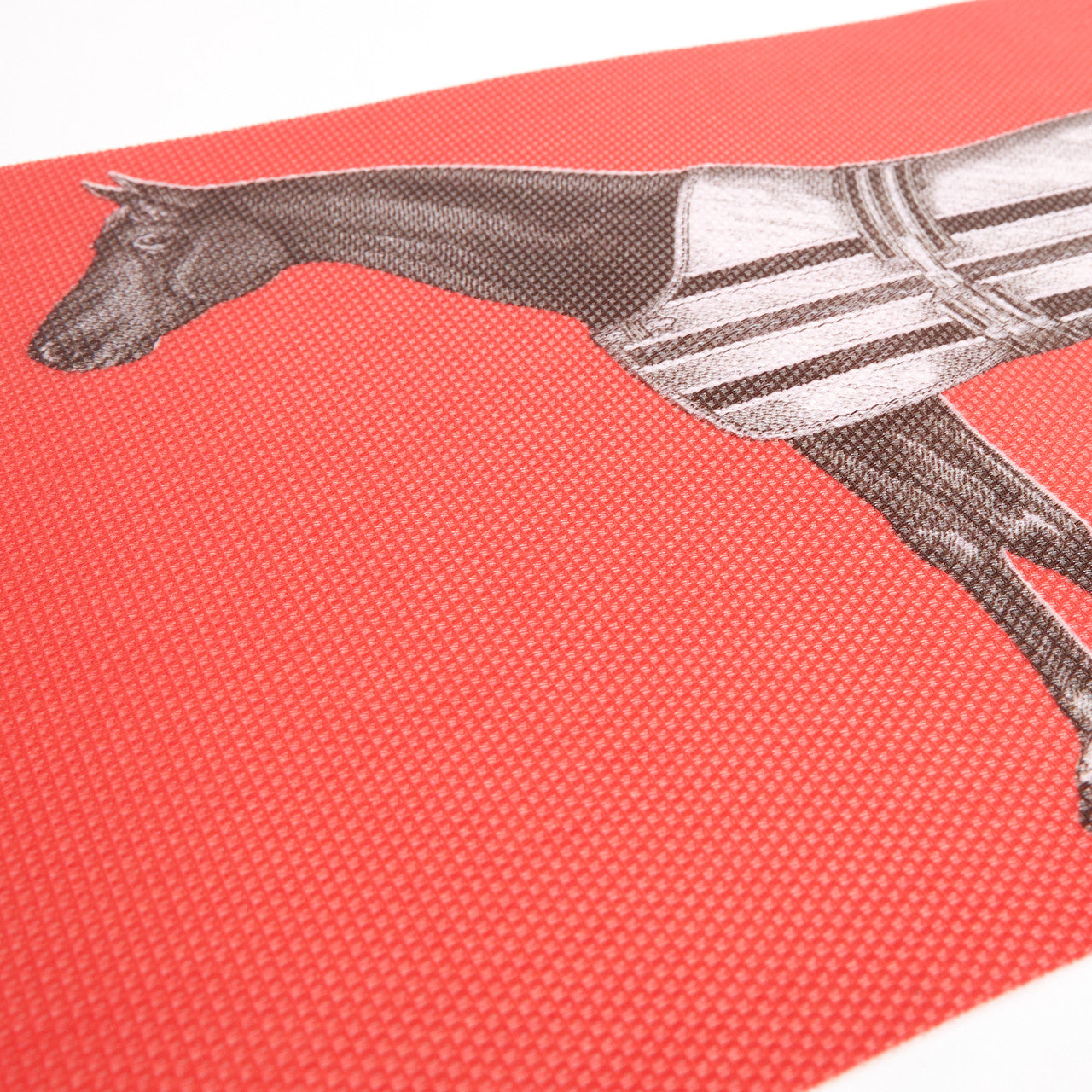 Horse illustration on a red vinyl textured table runner