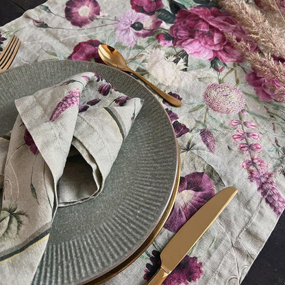 Table setting with the Green Blossom Garden table runner, gray plate, gold cutlery, and matching napkin.

