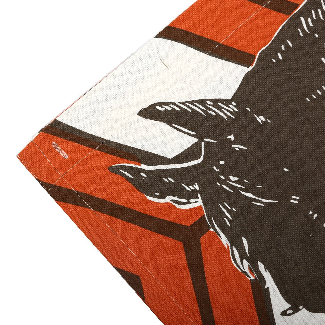 Detail of Thoroughbred horse illustration screen printed on a shower curtain with an orange geometric pattern and fabric holes.