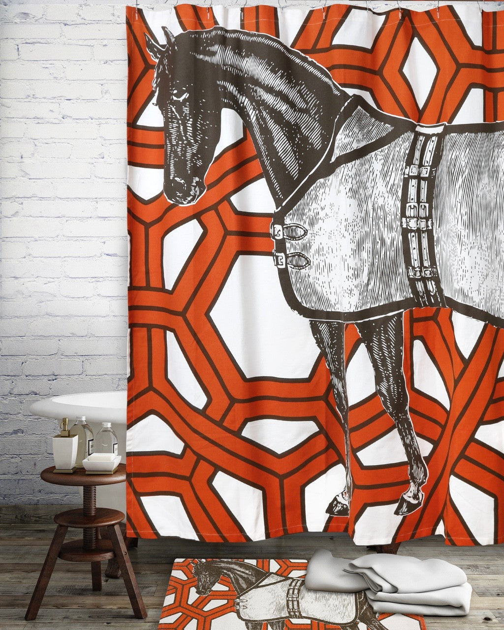 Thoroughbred horse illustration screen printed on a shower curtain with an orange geometric pattern and matching rug