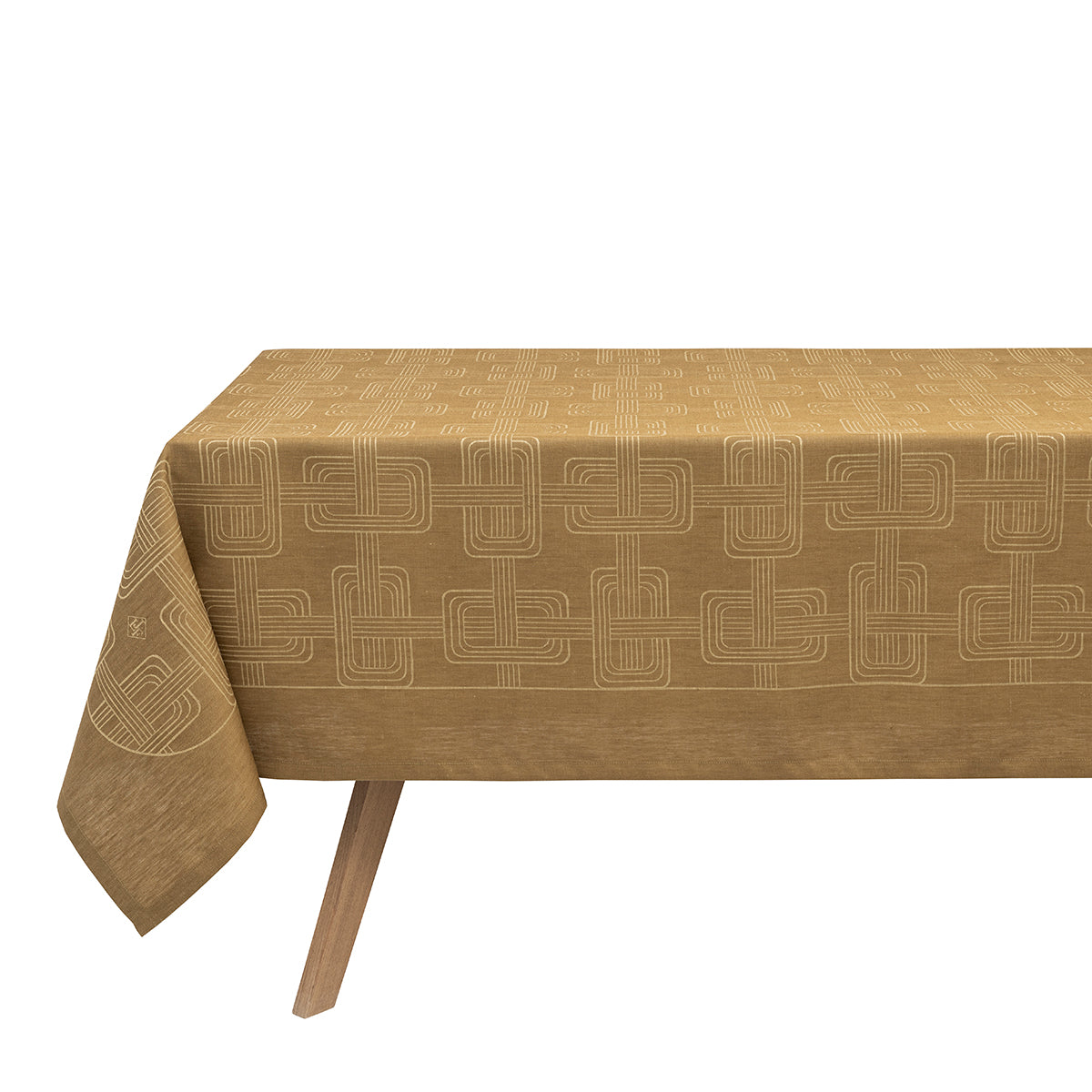 A tan brown Hôtel Particulier Jacquard tablecloth draped over a table, featuring a repeating geometric interlocking-link pattern.