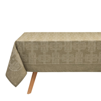An olive green Hôtel Particulier Jacquard tablecloth draped over a table, featuring a repeating geometric interlocking-link pattern.