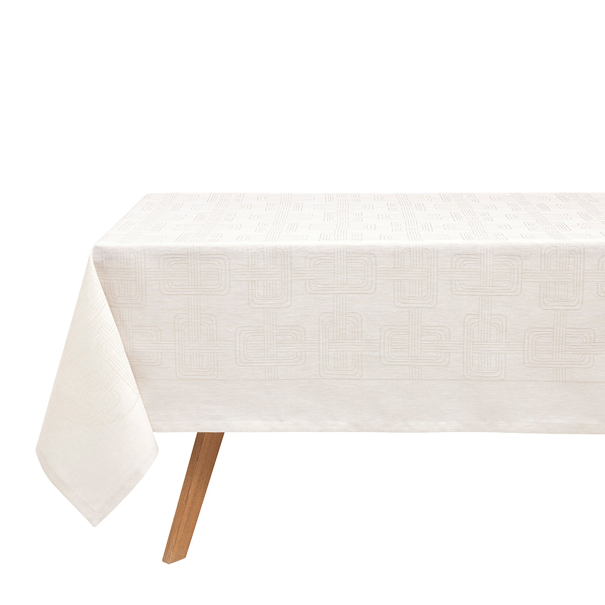 A light grey Hôtel Particulier Jacquard tablecloth draped over a table, featuring a repeating geometric interlocking-link pattern.