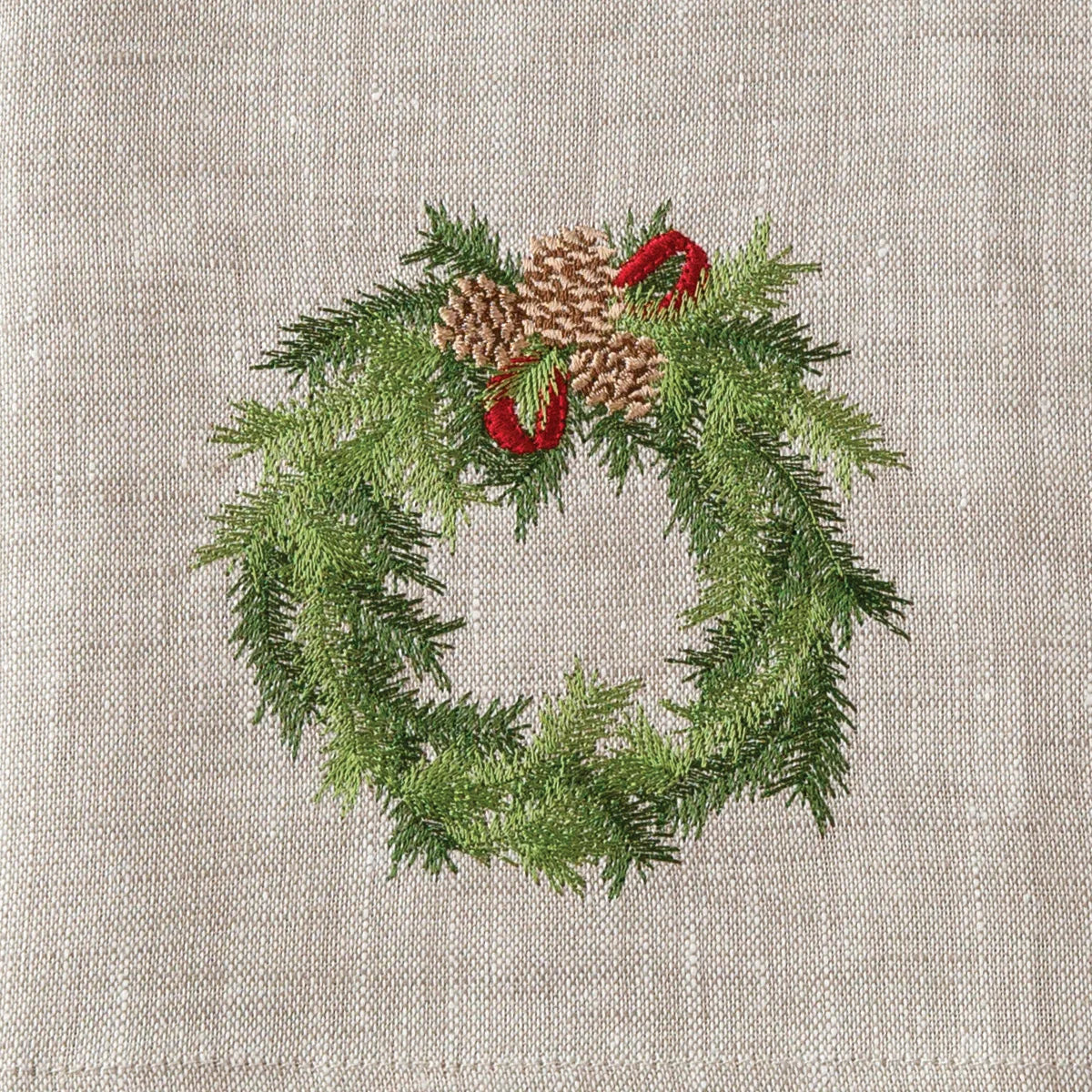 Soft flax European linen towel with embroidered holiday wreath design.