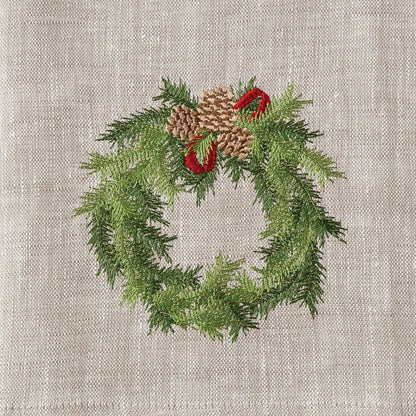 Soft flax European linen towel with embroidered holiday wreath design.