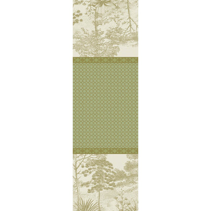 Full view of Le Sud Vert Jacquard Table Runner with shades of green geometric patterns and tree motifs.
