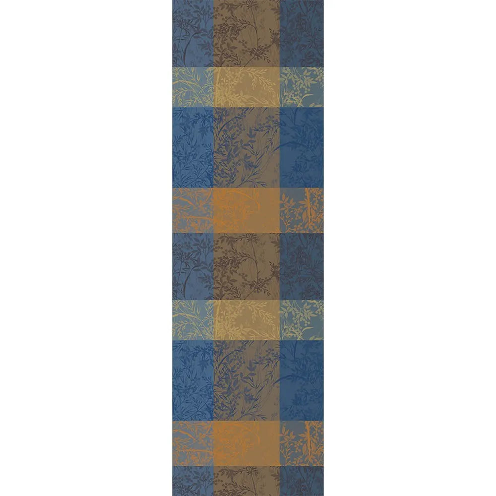 Mille Branchages table runner with a blue and gold checkered pattern on a white background