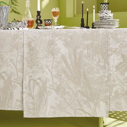 Mille Esprit Jardins Table Runner in a cream botanical floral cotton jacquard draped elegantly across a set table in a lime green room. 