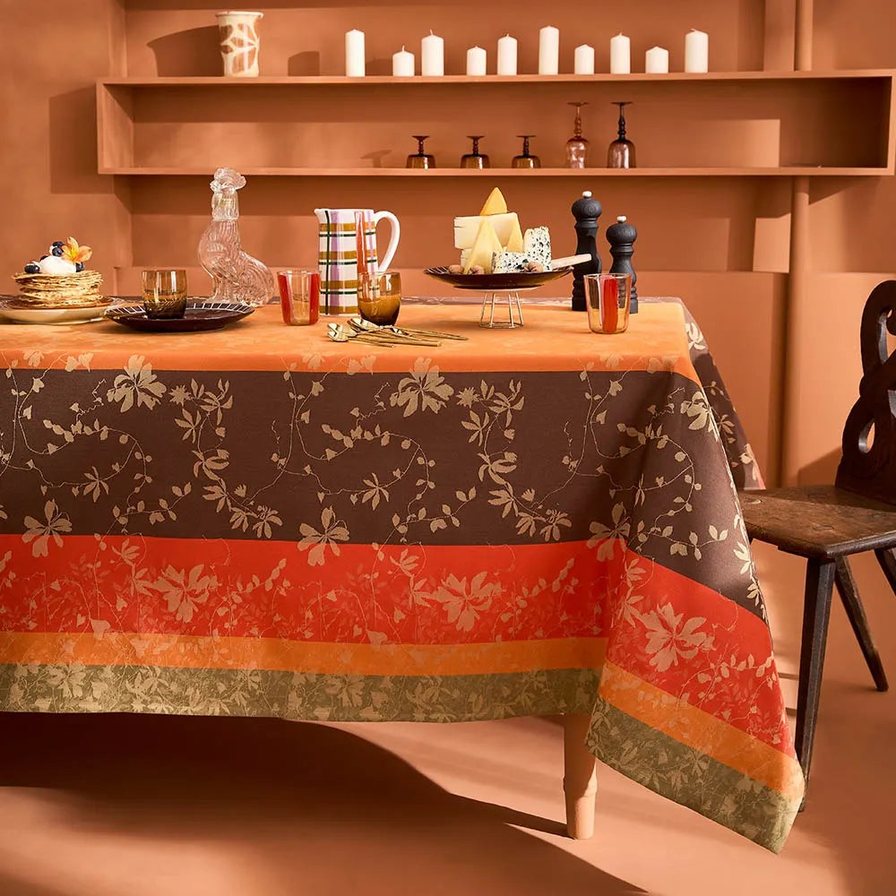 Striped autumn leaf cotton jacquard tablecloth styled on a festive dining table in a terracotta room.