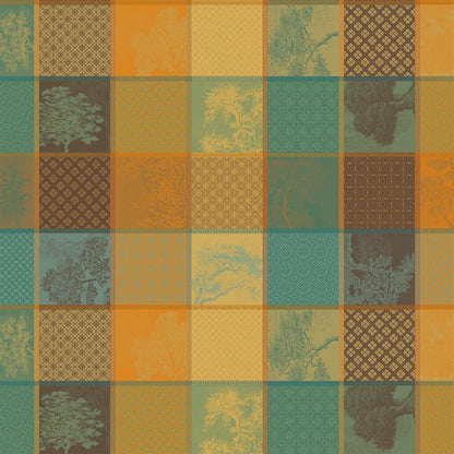 Warm-toned patchwork plaid cotton jacquard tablecloth in teals, browns, orange, and gold.