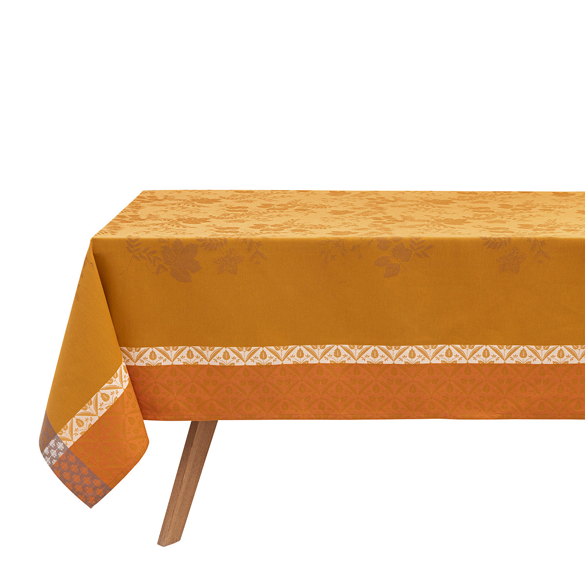 Close-up view of the Manor Lane tablecloth showing the woven Jacquard leaf and floral pattern, finished edges, and rich mustard yellow fabric detail.