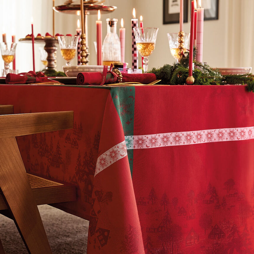 Close-up of red Sous Les Étoiles jacquard tablecloth. 