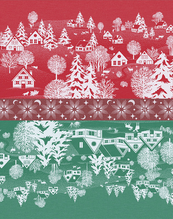 A cotton dishtowel with a holiday village print. The top section is red with white silhouettes of houses, trees, and snowflakes.