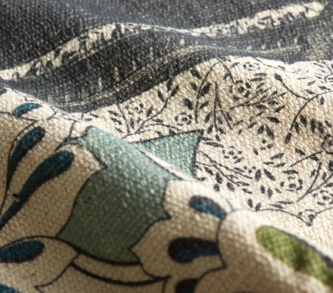 Close-up of a cotton rug, hand-loomed with a floral pattern