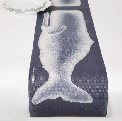 Vinyl table runner with a whale illustration