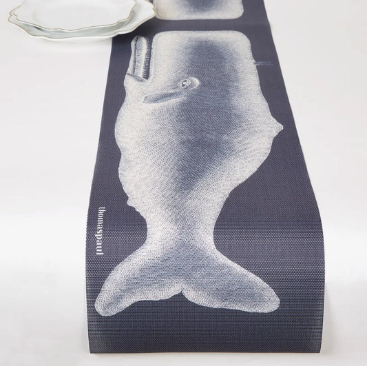 Vinyl table runner with a whale illustration